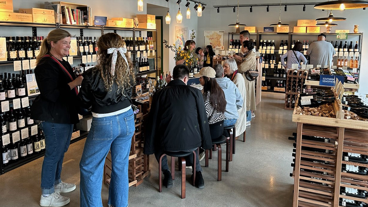 Customers at a wine tasting inside Story in a Bottle Wines
