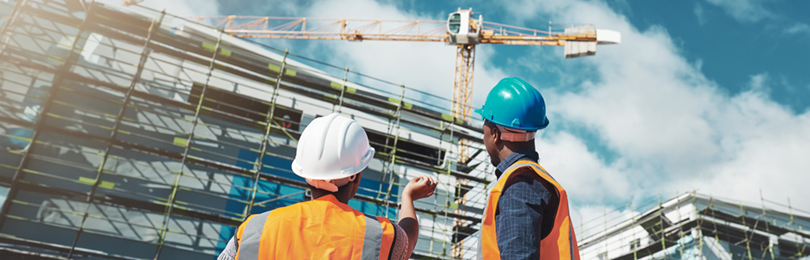 Construction workers discuss next steps of a build