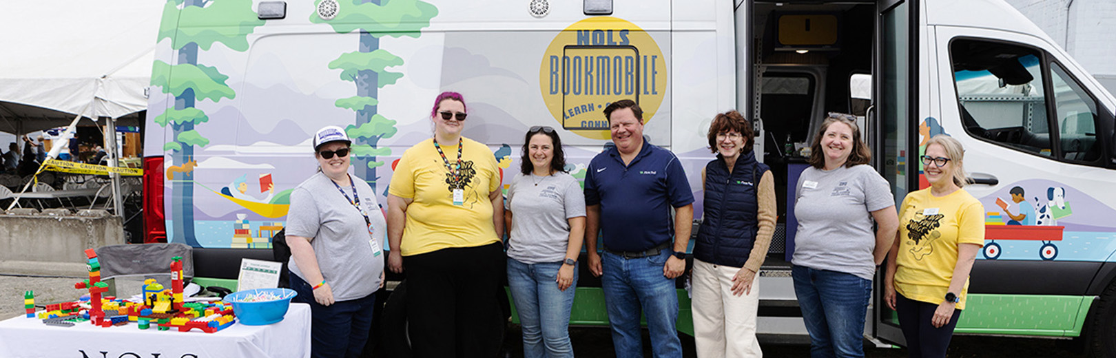 First Fed team with NOLA team in front of the Bookmobile
