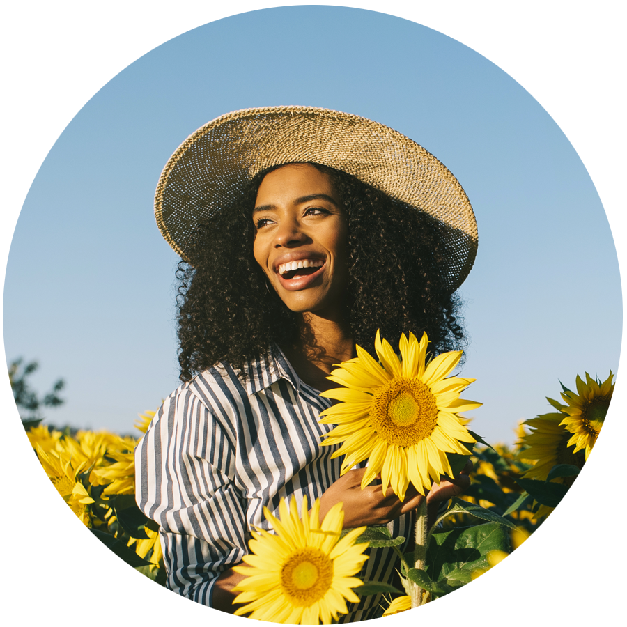 Woman Walking Among Sunflowers
